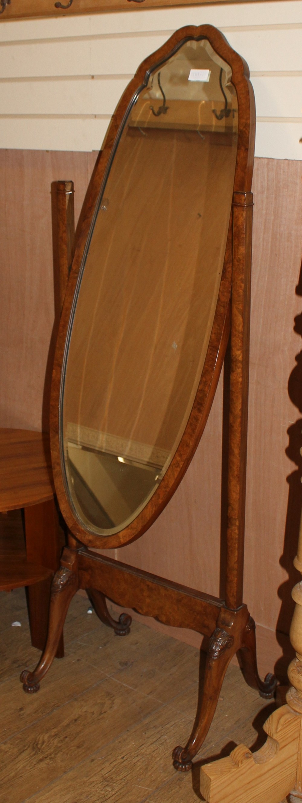 A walnut cheval mirror and a satin maple coffee table, L.150cm D.81cm H.41cm